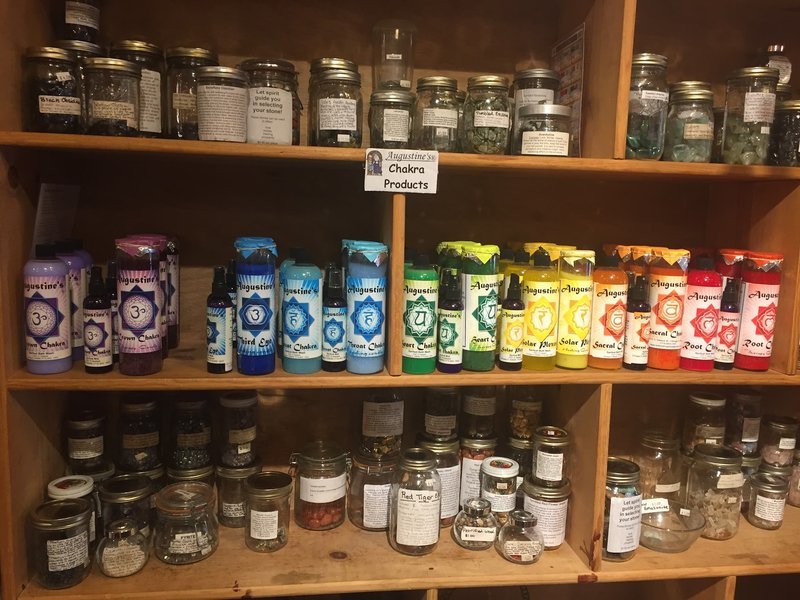 Cozy spiritual shop interior with vintage furniture, crystals, and candles on coffee table