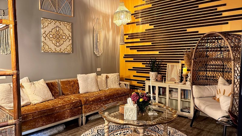 Shelving display featuring amethyst, quartz, and various crystal specimens
