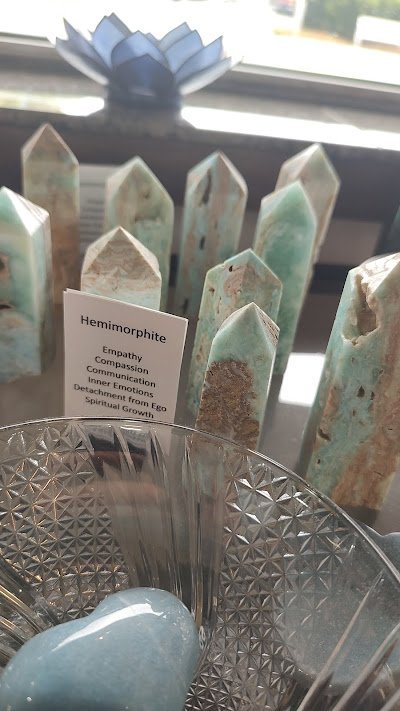 Collection of tumbled stones, raw minerals, and crystal clusters