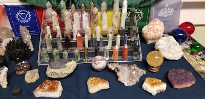 Crystal and mineral specimens including quartz, amethyst, and calcite varieties