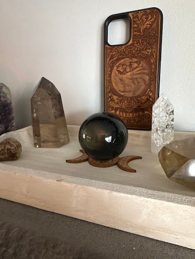 Interior view showcasing crystal towers, spheres, and carved stone pieces