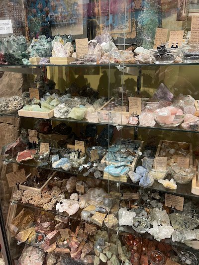 Retail shelving with organized crystals, stones, and spiritual products