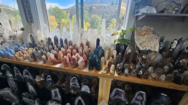 Organized crystal display with labeled stones and healing minerals