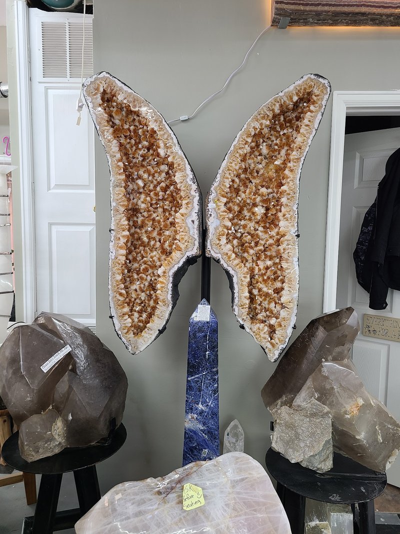 Variety of gemstones, crystal carvings, and polished mineral specimens