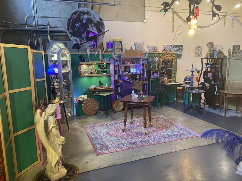 Retail shelving with organized crystals, stones, and spiritual products