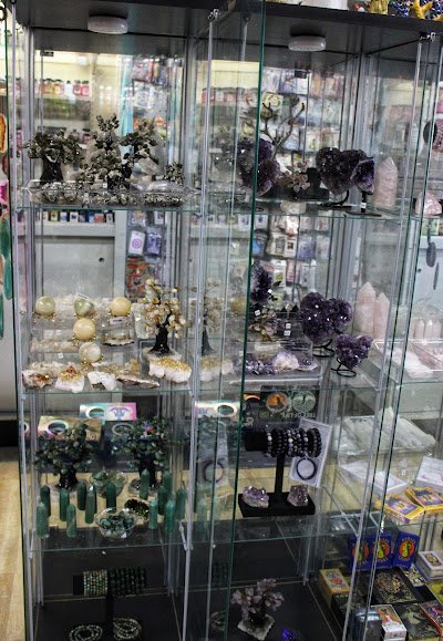 Collection of tumbled stones, raw minerals, and crystal clusters