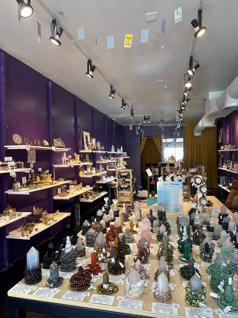Shop interior featuring gemstones, healing crystals, and spiritual products