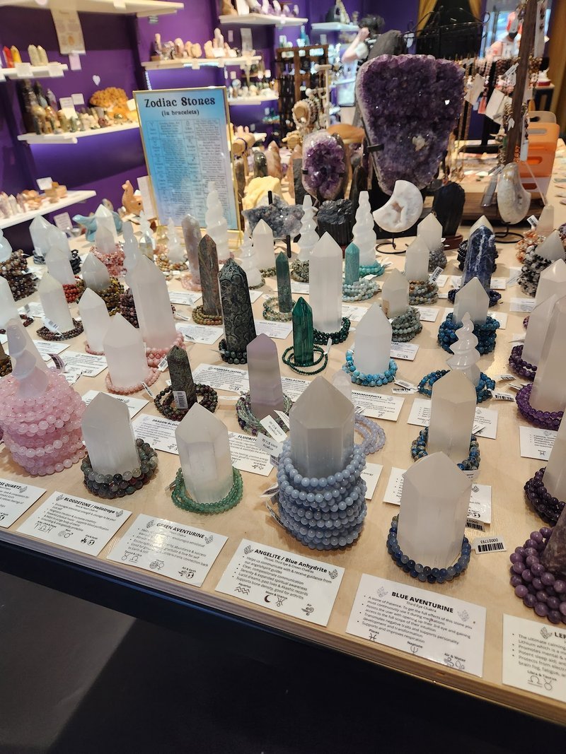 Display of polished crystal specimens, geodes, and mineral towers