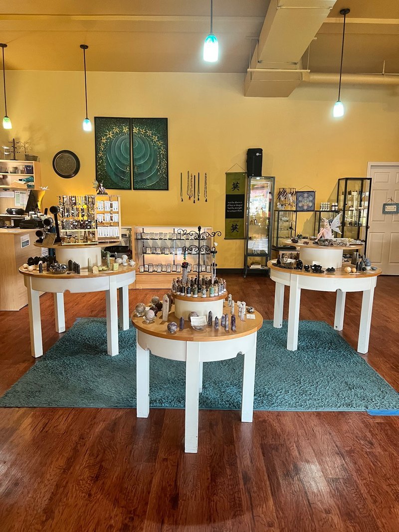 Display of polished crystal specimens, geodes, and mineral towers