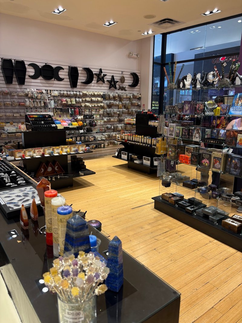 Shop interior featuring gemstones, healing crystals, and spiritual products