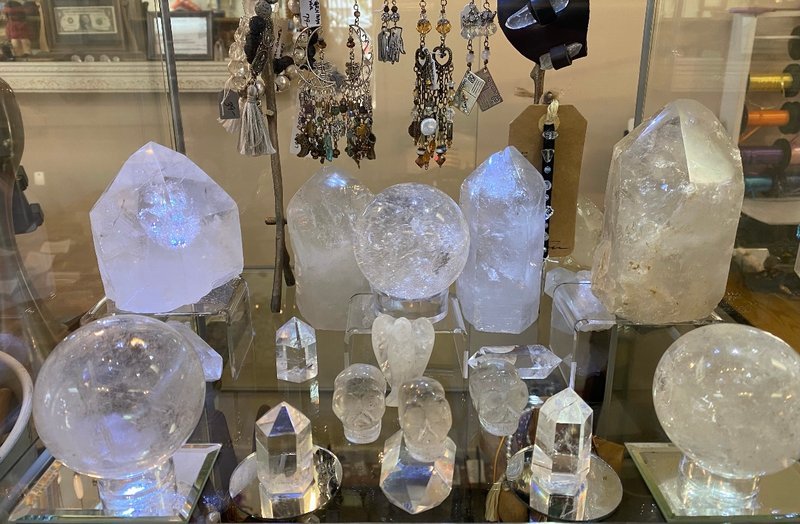 Selection of healing crystals, tumbled stones, and decorative mineral pieces