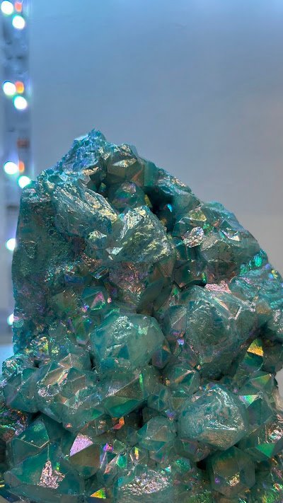 Iridescent green dioptase or emerald crystal cluster specimen with metallic rainbow sheen