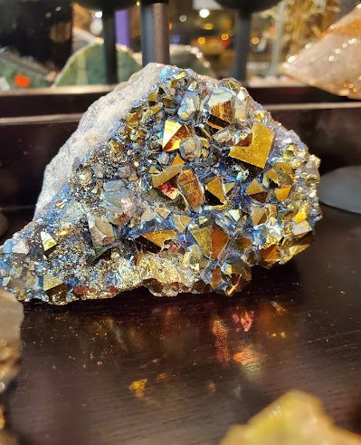 Shop interior featuring gemstones, healing crystals, and spiritual products