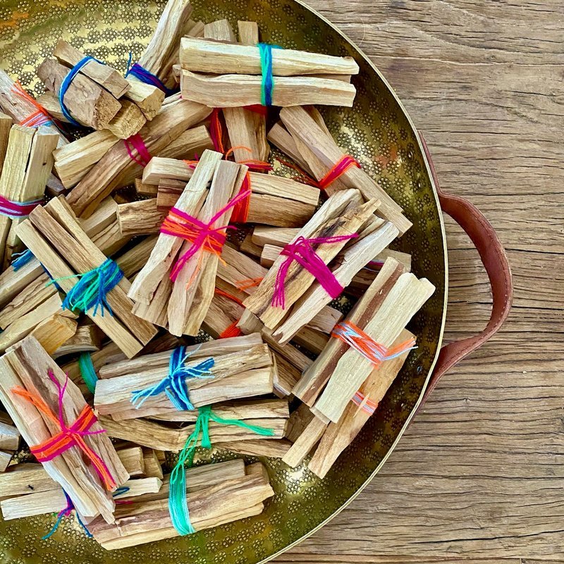 Collection of tumbled stones, raw minerals, and crystal clusters