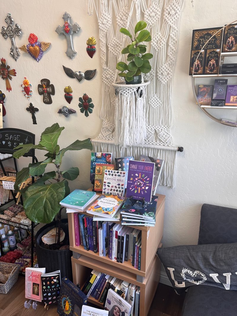 Display featuring crystal points, polished stones, and raw mineral specimens