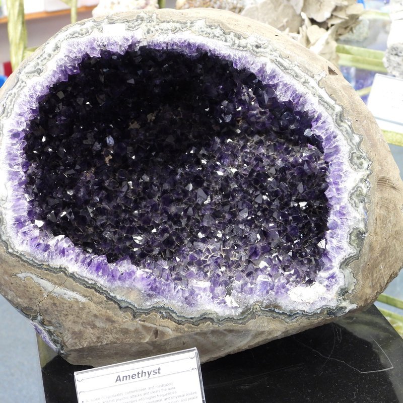 Selection of healing crystals, tumbled stones, and decorative mineral pieces