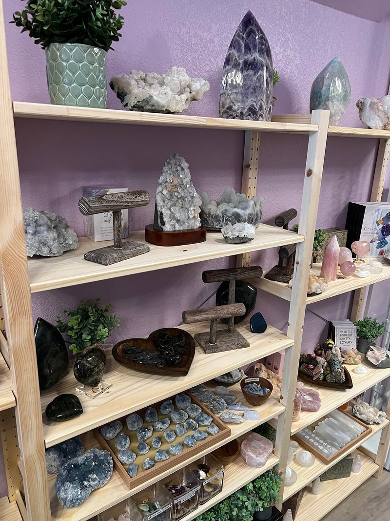 Organized crystal display with labeled stones and healing minerals