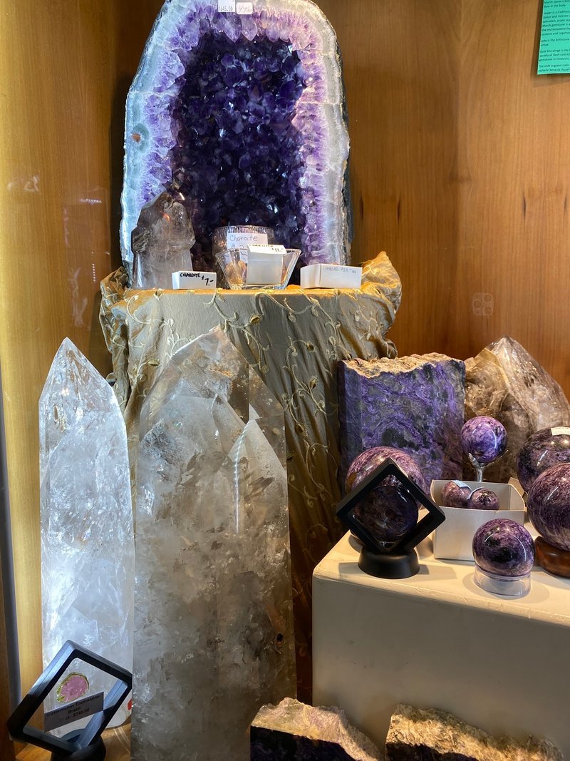 Organized crystal display with labeled stones and healing minerals