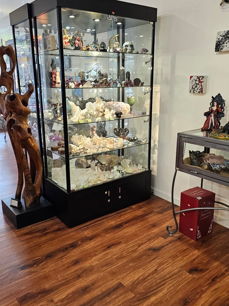 Display of polished crystal specimens, geodes, and mineral towers