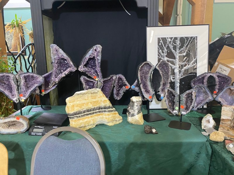 Retail shelving with organized crystals, stones, and spiritual products