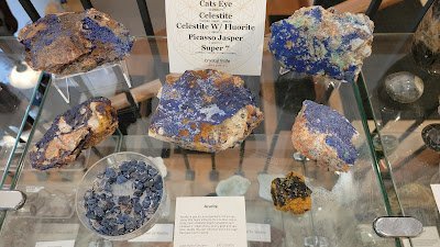 Shop interior featuring gemstones, healing crystals, and spiritual products