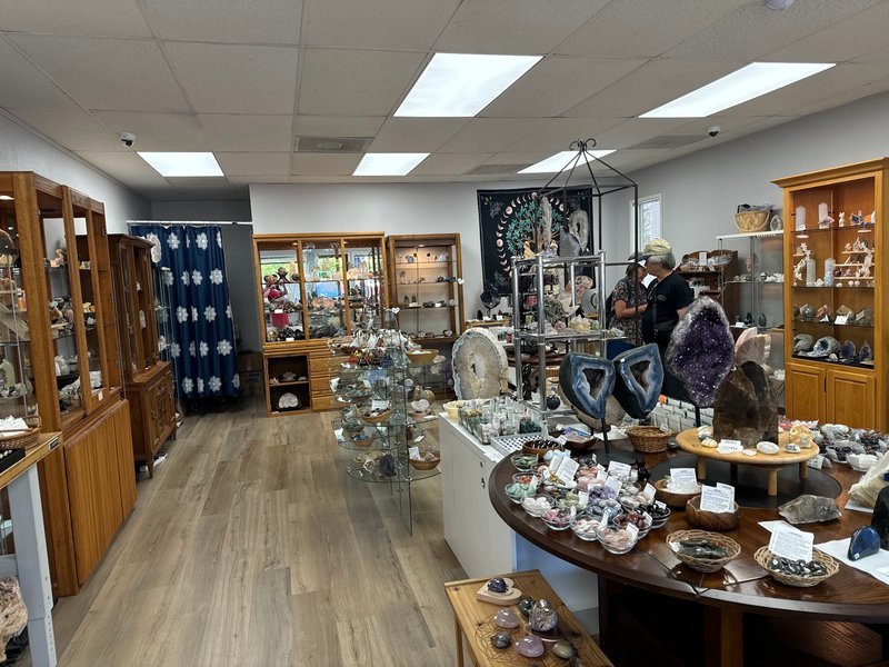 Shop interior featuring gemstones, healing crystals, and spiritual products