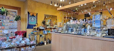 Store interior with glass display cases featuring crystals and minerals