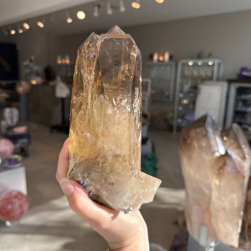 Variety of gemstones, crystal carvings, and polished mineral specimens