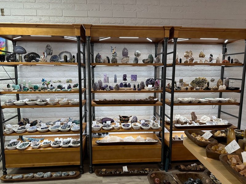 Retail display with tumbled stones, raw crystals, and polished specimens