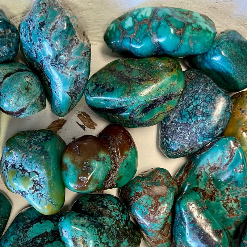 Crystal and mineral specimens including quartz, amethyst, and calcite varieties