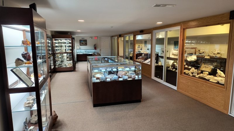 Retail display with tumbled stones, raw crystals, and polished specimens