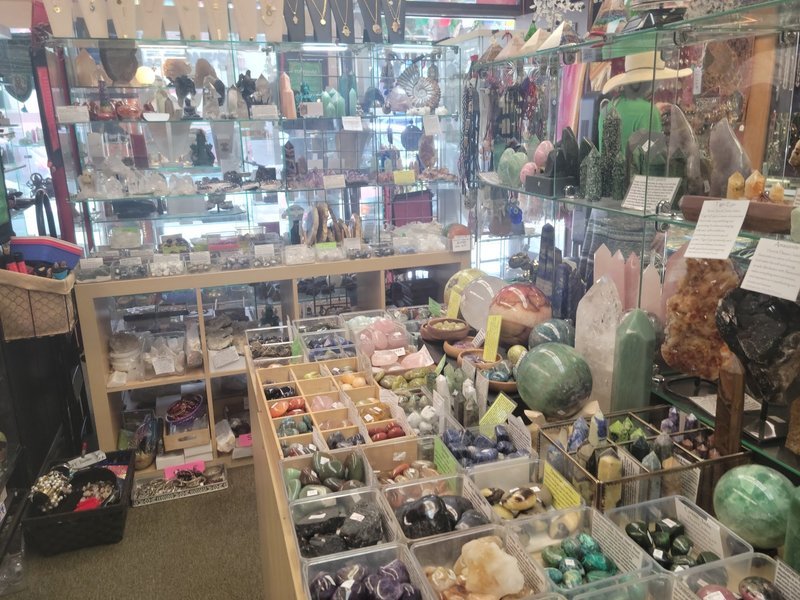 Organized crystal display with labeled stones and healing minerals
