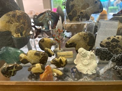 Retail shelving with organized crystals, stones, and spiritual products