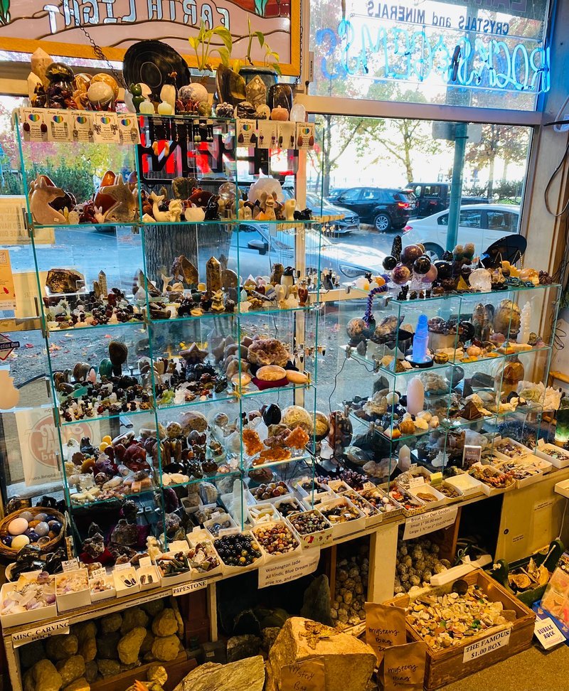 Retail display with tumbled stones, raw crystals, and polished specimens