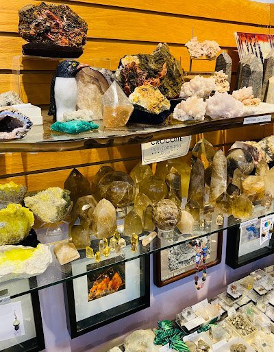 Crystal and mineral specimens including quartz, amethyst, and calcite varieties