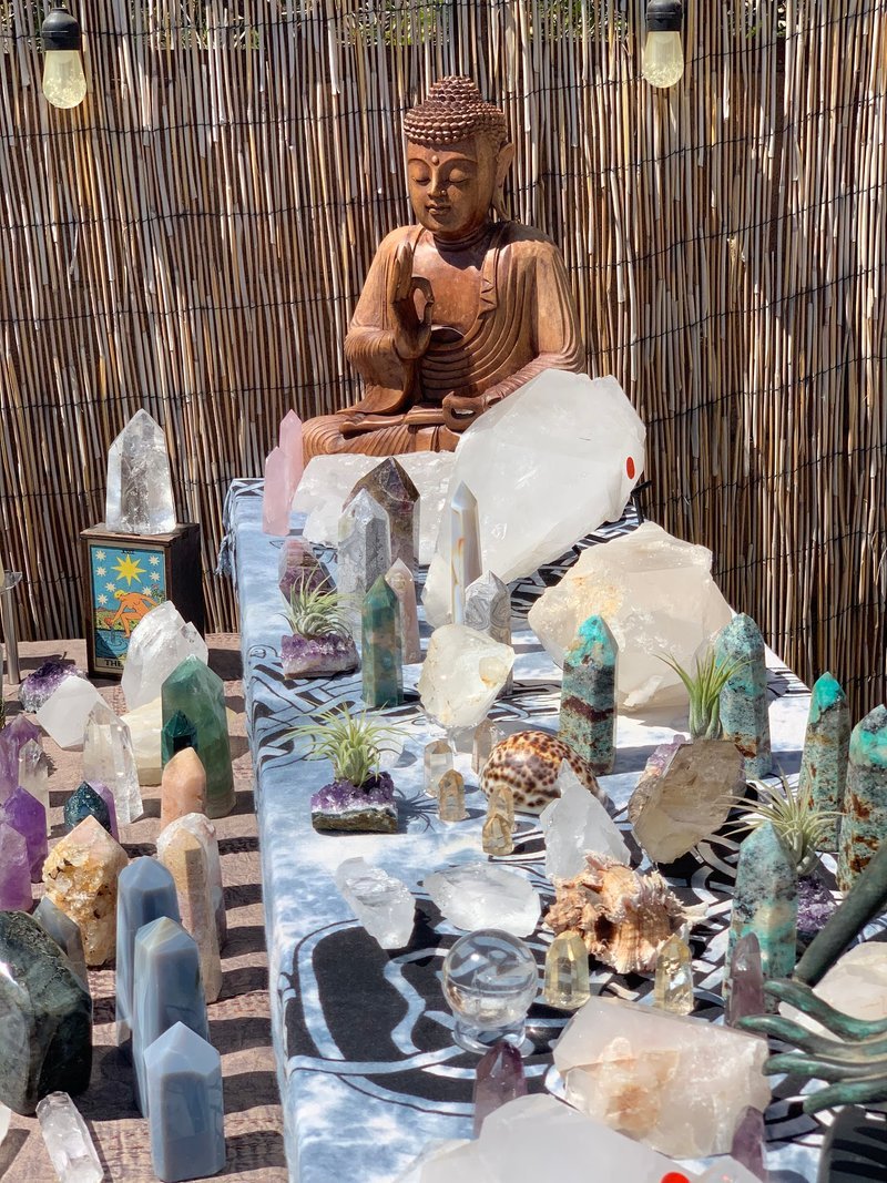 Display of polished crystal specimens, geodes, and mineral towers