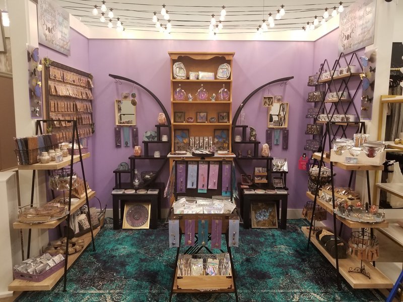 Shop interior featuring gemstones, healing crystals, and spiritual products