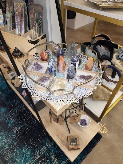 Shelving featuring chakra stones, healing crystals, and mineral specimens