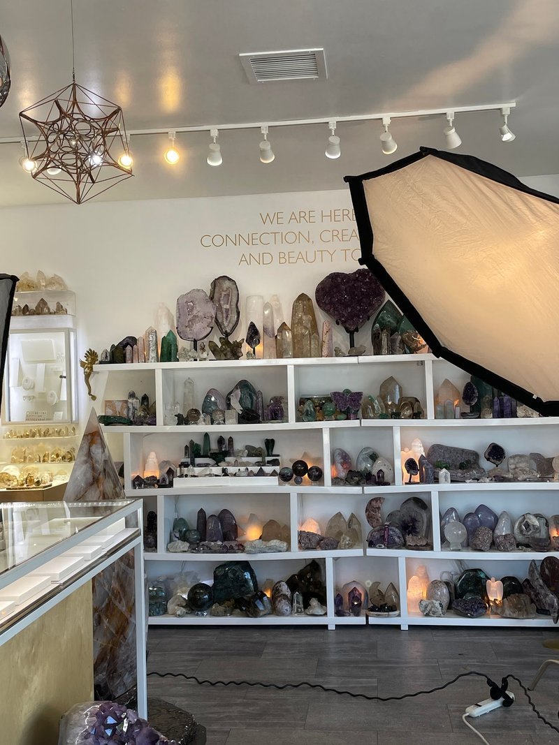 Organized crystal display with labeled stones and healing minerals