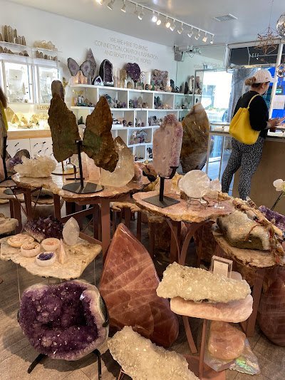 Crystal and mineral specimens including quartz, amethyst, and calcite varieties