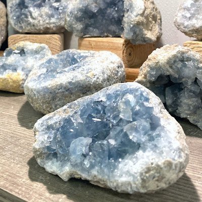 Selection of healing crystals, tumbled stones, and decorative mineral pieces