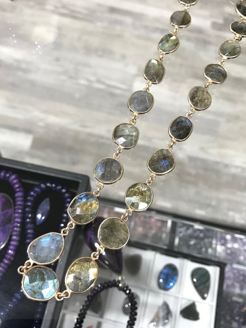 Variety of gemstones, crystal carvings, and polished mineral specimens