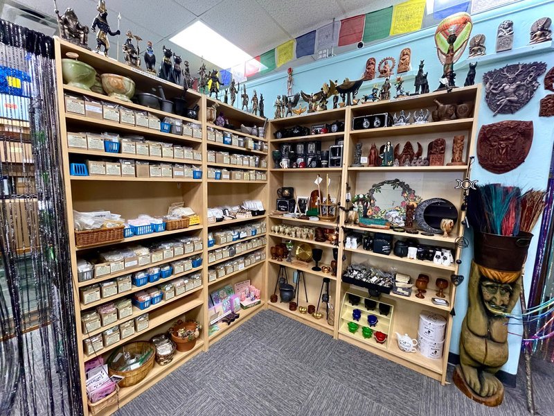 Collection of tumbled stones, raw minerals, and crystal clusters