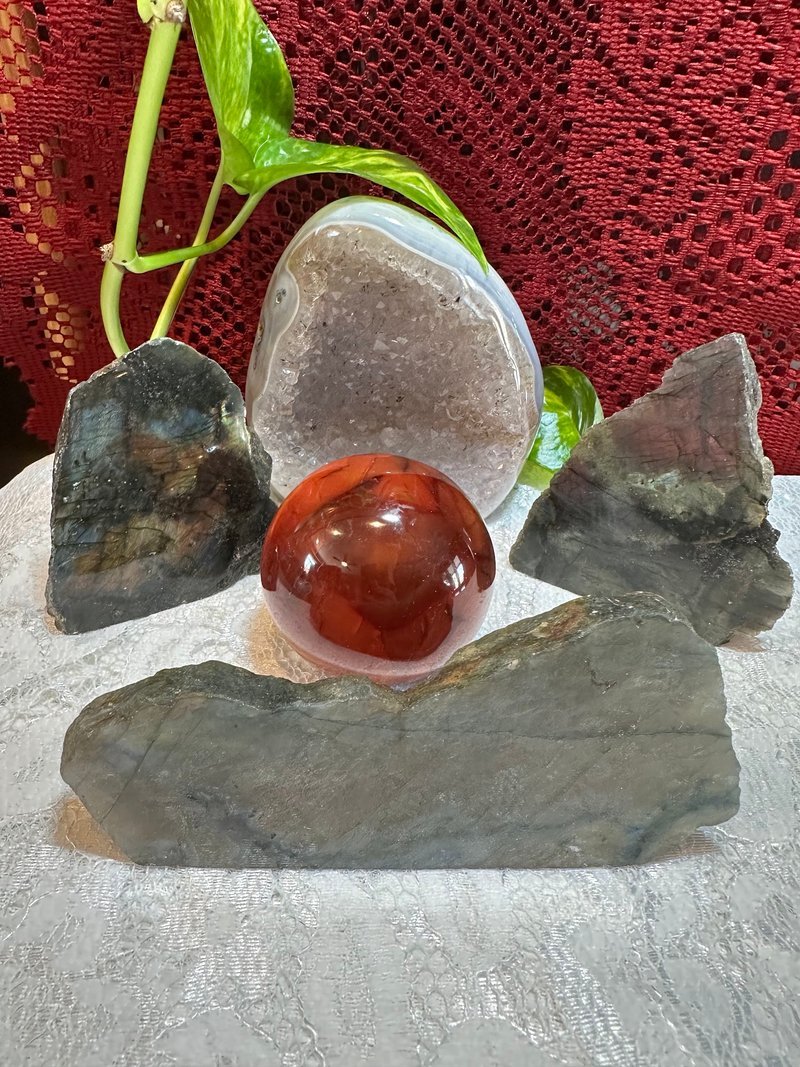 Retail shelving with organized crystals, stones, and spiritual products