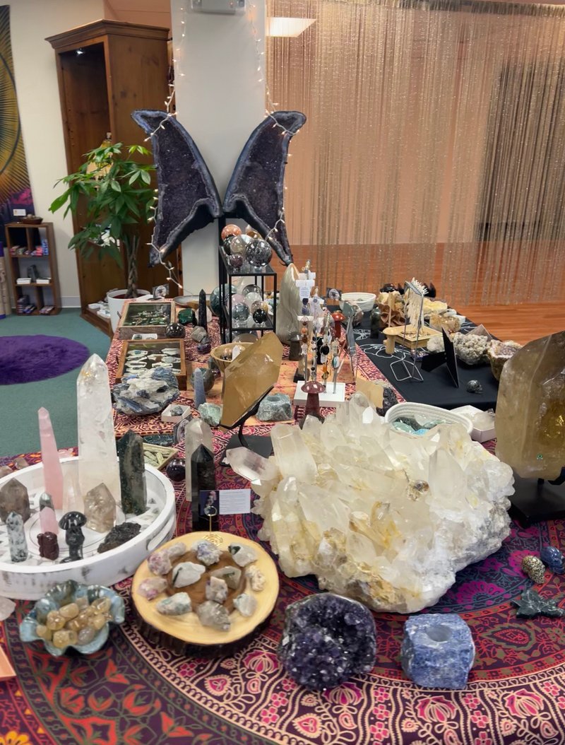 Organized crystal display with labeled stones and healing minerals