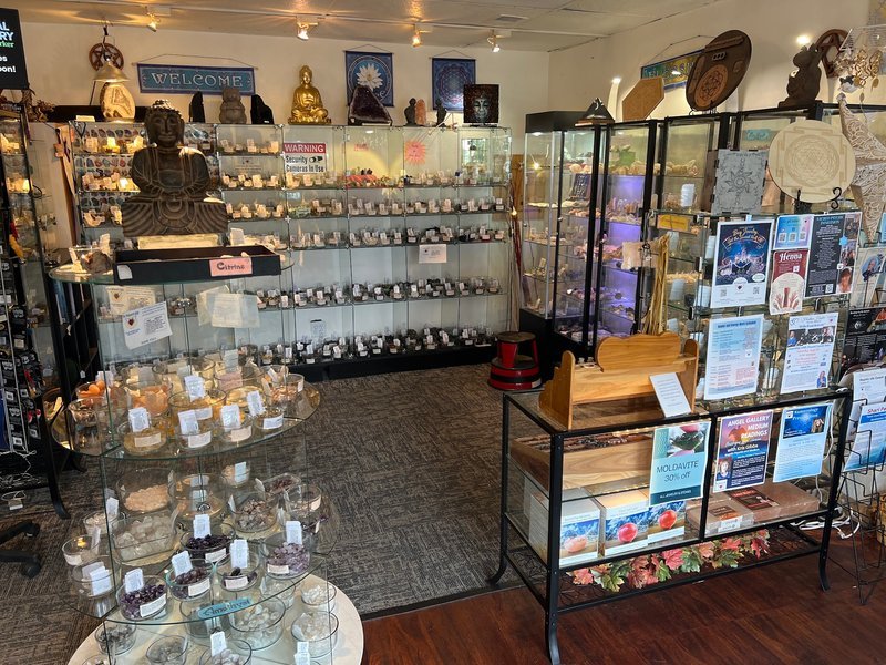 Collection of tumbled stones, raw minerals, and crystal clusters