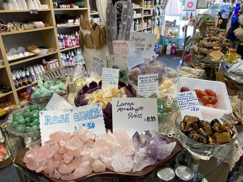 Shop interior featuring gemstones, healing crystals, and spiritual products