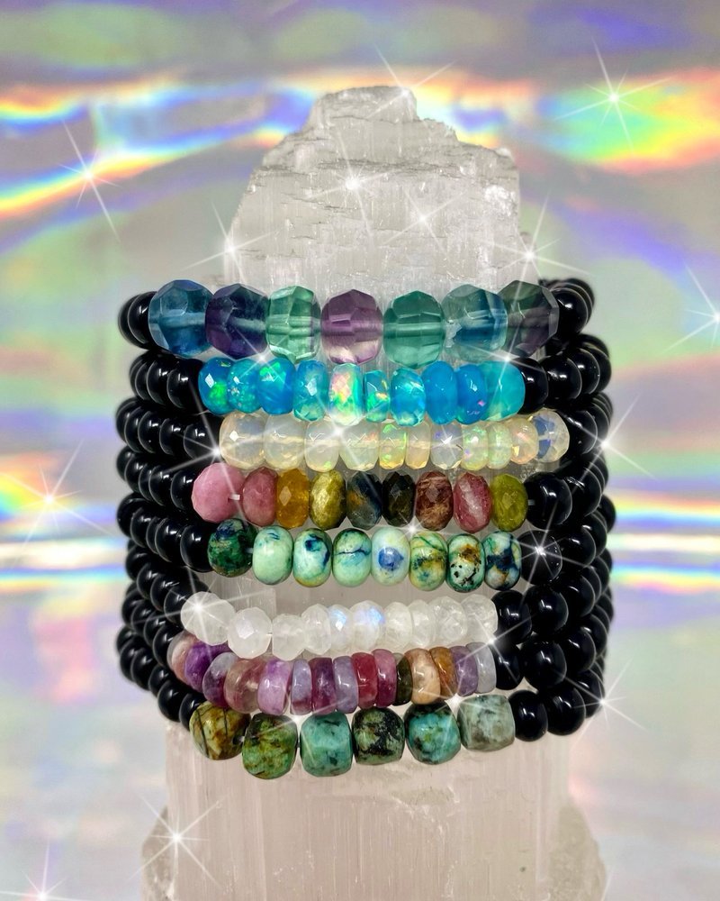 Selection of healing crystals, tumbled stones, and decorative mineral pieces