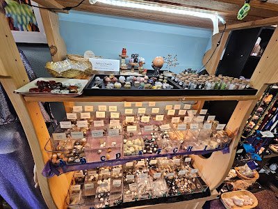 Shop interior featuring gemstones, healing crystals, and spiritual products