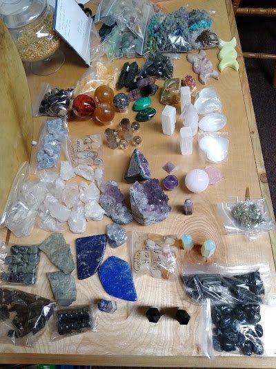 Crystal and mineral specimens including quartz, amethyst, and calcite varieties